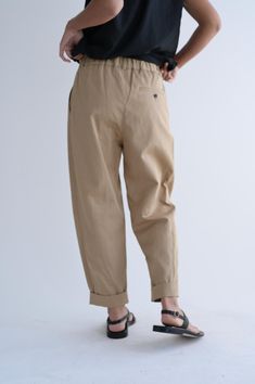 The Sunday Twill Pant is a high-waisted tapered trouser with long side pleats and an elastic band at the back of the waist. 79% cotton, 21% linen.Single button closure with zipper, elastic at back of waist.Tapered leg.Cropped length.Made in Japan. Peter Pan Collar Blouse, Petal Sleeve, Tapered Trousers, Twill Pants, Marine Serre, Collar Blouse, Sleeve Detail, Tapered Legs, Trousers Women