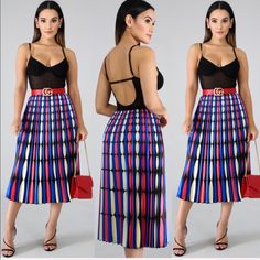 Our Beautiful And Colorful Midi Skirt Features A Dazzling Color Pattern. The Colors Are Bright And Vibrant. The Material Is Lightweight. The Skirt Features A Beautiful Pleat Design. This Midi Skirt Is A True One Size Fits Most And Features An Elastic Band For Ease And Comfort. The Black Top And Red Belt Is Not Included. Casual Multicolor Skirt For Party, Casual Multicolor Party Skirt, High Waist Multicolor Lined Skirt, Multicolor Flared Skirt For Day Out, Multicolor Pleated Midi Skirt For Summer, Multicolor Midi-length Skirt With Lined Detail, Multicolor Midi Length Skirt With Lined Skirt, Multicolor Lined Midi Length Skirt, Multicolor Midi Length Skirt With Lining