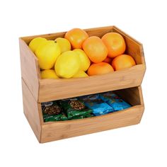 a wooden box filled with oranges and lemons