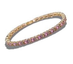 This exquisite yellow-gold tennis bracelet features a stunning round pink tourmaline accented by 2 tiny diamonds, adding a touch of elegance and sparkle.  Perfect for both casual and formal occasions, its timeless design complements any outfit. Whether you're looking for a meaningful gift or a luxurious treat for yourself, this bracelet is the perfect choice.  A beautiful symbol of grace and sophistication, it makes an ideal gift for birthdays, anniversaries, or special celebrations. Add a hint Grace Symbol, Gold Tennis Bracelet, Bracelet Tennis, Beautiful Symbols, Tiny Diamond, Pink Bracelet, Tennis Bracelet, Elegant Jewelry, Pink Tourmaline