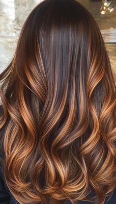 Transform your tresses with 24 mesmerizing caramel balayage hairstyles that will make you shine. This expert coloring technique uses hand-painted caramel hues to create a natural, sun-kissed effect that grows out beautifully. From subtle honey accents to bold caramel ribbons, discover the perfect balance of warmth and dimension for your locks. Embrace the sweet sophistication of caramel balayage and enjoy effortlessly chic hair that turns heads wherever you go. Caramel Macchiato Balayage, Hair With Caramel Highlights, Amber Balayage Brunettes, Brown Caramel Balayage Hair, Light To Dark Balayage, Balayage Hair Caramel Honey, Caramel Mocha Balayage, Dark Caramel Balayage On Black Hair, Auburn Brunette Hair Balayage