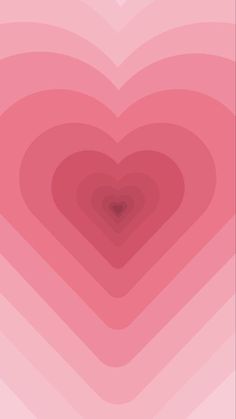 a heart shaped object in the middle of a pink background