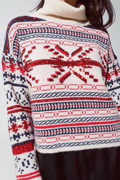 Celebrate the holiday season in style with our Cream Christmas Sweater. Embellished with a charming Christmas-themed print in red and blue, this sweater is adorned with sparkling sequin details, making it the perfect pick for your festive gatherings. Festive Design: The sweater showcases a delightful Christmas style print, enhanced with eye-catching sequin details for a touch of holiday sparkle. Cozy Turtle Neck: Stay warm and stylish with the chunky turtle neck design, perfect for those chilly Winter Holiday Fair Isle Pattern Tops, Winter Holiday Fair Isle Tops, Christmas Knit Top With Fair Isle Pattern, Holiday Crew Neck Top With Fair Isle Pattern, Sequined Sweater For Winter, Holiday Fair Isle Pattern Crew Neck Top, Holiday Fair Isle Crew Neck Top, Red Knit Christmas Top, Red Festive Winter Sweater