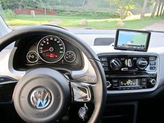 the steering wheel and dashboard of a car with an electronic display on the dash board