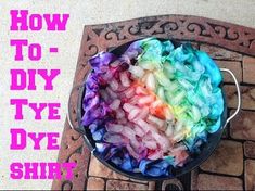 a pot filled with dye sitting on top of a brick floor