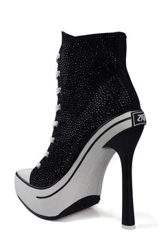 Sparkling rhinestones and a lofty stiletto heel put a glam twist on this sneaker-inspired pointy-toe bootie. 5 1/2" heel; 2 1/2" platform 4 1/2" shaft Textile upper/leather lining/synthetic sole Imported High-top 4-inch Heel Party Heels, High-top Heels With 4-inch Heel For Party, Sneaker Ball, Nike Heels, Pink Nike Shoes, Sneakers Heels, Luxury Winter, Black High Heel Boots, Pink Nike