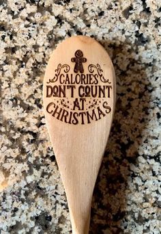 a wooden spoon that says calories don't count at christmas