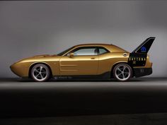 a gold sports car with its hood open