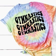 Listing is for 1 Gymnastics Shirt in Tie Dye or Solid Color Tops.  -Great, for all gymnast, or to cheer on your favorite gymnast during meet season or all year. Makes a cute gift for birthdays and Christmas holidays.  Main Listing Photo: Tie Dye Shirt 2nd Main Listing photo:  Tie dye and white shirts featuring black lettering.  2nd Listing photo:  Pink and black shirt featuring white and black lettering.  Branding: Tie Dye Adult: Port and Company/ColorTone Youth: Port and Company/ColorTone  *Fit Tumbling Gymnastics, Pink Gym, Gymnastics Shirts, Gymnastics Gifts, Team Coaching, Tie Dye Outfits, Tie Dye Shirt, Gym Shirts, Birthday Gifts For Girls