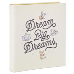 a book with the words dream big dreams written in black ink on it's cover