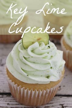 key lime cupcakes on a wooden table with the words key lime cupcakes