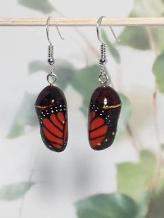 MONARCH CHRYSALIS EARRINGS - beautiful hand sculpted monarch butterfly chrysalis earrings, a great gift idea! by LadyDivergent on Etsy https://www.etsy.com/listing/691812474/monarch-chrysalis-earrings-beautiful Monarch Chrysalis, Butterfly Chrysalis, Monarch Butterfly, Beautiful Hand, Fashion Inspiration, New Zealand, Dangle Drop Earrings, Great Gifts, Style Inspiration