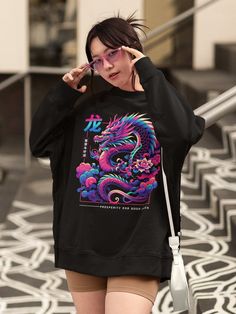 Embrace the power, luck, and charisma of the dragon with our 'Year of the Dragon Sweatshirt.' This stunning sweater pays homage to the Chinese zodiac's Year of the Dragon, symbolizing strength, wisdom, and good fortune. Get yours now! Available on tshirts, sweatshirt and hoodies: https://www.etsy.com/shop/TheNims?search_query=Year+Of+The+Dragon Browse through my other awesome items here: http://thenims.etsy.com/ ABOUT THE PRODUCT: Unisex Heavy Blend™ Crewneck Sweatshirt | GILDAN 18000 (Customer Dragon Sweater, Dragon Sweatshirt, Year Sweatshirt, Zodiac Years, Chinese Zodiac Signs, Year Of The Dragon, Chinese Dragon, Chinese Zodiac, Lunar New Year