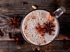 an overhead view of a drink with cinnamon and star anise