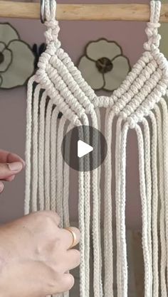 someone is making a macrame dream catcher