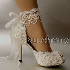 white bridal shoes with lace and bows