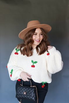 This charming knit sweater features delightful cherry embellishments, adding a playful touch to the cozy design. The oversized fit and chunky knit make it perfect for staying warm while maintaining a relaxed, stylish look. Pair it with your favorite jeans for a cute and casual outfit or a skirt to dress it up. Fit Details : Oversized ; 60% cotton 40% acrylic Model Details: Model is wearing a size S Skirt To Dress, Cozy Design, Fit Details, Chunky Knits Sweater, Favorite Jeans, Chunky Knit, Casual Outfit, Stay Warm, Knit Sweater