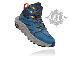 a pair of blue and yellow shoes with orange laces on the outstep