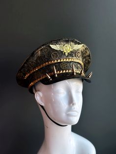 Our captain hat boasts an authentic steampunk aesthetic. Intricate gears, cogs, and spike elements adorn the hat, transporting you to an era of innovation and daring feats.


Age Group/Gender - Adult/Unisex

Size/Type - One size fits all adults

Mask Color - Gold Steampunk High Crown Hat For Themed Events, Steampunk High Crown Costume Accessories For Cosplay, Vintage High Crown Costume Hats For Cosplay, Steampunk Top Hat With High Crown For Themed Events, Steampunk Adjustable Costume Hats And Headpieces, Steampunk High Crown Mini Hat For Themed Events, Adjustable Punk Costume Accessories For Themed Events, Adjustable Punk Style Costume Accessories For Themed Events, Punk Style High Crown Hat For Themed Events