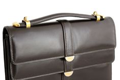 "MORABITO, 1 Place Vendome Paris, vintage handbag of dark brown real leather. Small and rectangular, with two flaps, one closes over the main compartment and the other over the external pocket with a hidden snap button. Extendable short to medium-long handle. Interior lining in brown leather, with three pockets, one with a zipper. This bag has an exceptional leather and finish, made by one of the most upmarket and prestigious handbags firms. Ref.: B0578 CONDITION: Mint SIZE Approx.: 8,66\"L X 6, Classic Flap Bags For Formal Occasions, Formal Double Flap Satchel With Top Carry Handle, Formal Double Flap Satchel With Top Handle, Classic Rectangular Flap Bag With Top Carry Handle, Classic Briefcase With Hasp Closure, Modern Brown Flap Bag For Formal Occasions, Formal Square Satchel With Magnetic Closure, Timeless Brown Flap Bag For Office, Brown Double Flap Formal Bag