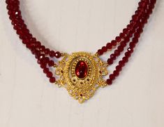 Stand out with this sparkling red and gold piece. With a baroque style pendant, this necklace is sure to catch the eye and make you feel like royalty all night long! Pendant: 1.6W × 1.6L Chain: 14in Red Necklace, Saint Valentine, Baroque Style, Gold Piece, Baroque Fashion, Long Pendant, Red And Gold, Chain Styles, Lady In Red