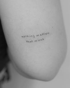 a woman's shoulder with the words nothing matters that much on her left arm