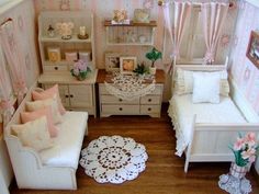 an overhead view of a dollhouse living room with furniture and flowers on the window sill