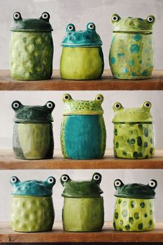 green and blue ceramic pots are lined up on the shelves in front of each other