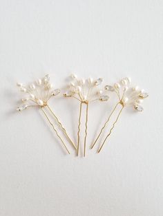 "Pretty hair pins for your wedding hair style. Embellished with navette shaped crystal rhinestones and freshwater pearls. These can be customized in different colors. I have Cream, Champagne and Pink colored freshwater pearls available. You can also choose the color of the wire which comes in Silver or Gold. Navette rhinestones are available in silver or gold metal bases. Sold as a set of three (3) First 7 photos show Gold pins with Champagne pearls and Gold/Gold rhinestones. Last 3 photos show Bride Hair Pearl Pins, Blue Pearl Hair Pin, Baroque Pearl Hair Pin, Wedding Hair Pins Crystal, Pearl Hair Pin Wedding, Pearl Wedding Hair, Pearl Bridal Hair, Bridal Hair Pins Pearl, Crystal Hair Vine