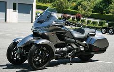 a black motorcycle parked in a parking lot