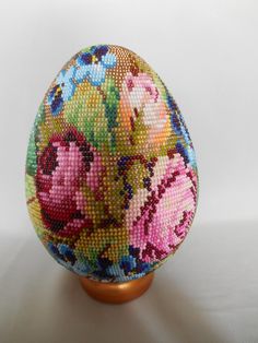 an egg with flowers painted on it