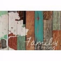 a wooden wall with the word family painted on it