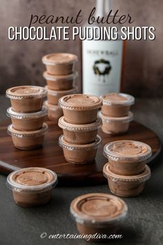 peanut butter chocolate pudding shots on a wooden tray