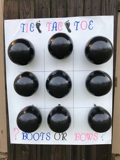 a sign that has some black balls on it with the words toe are too?