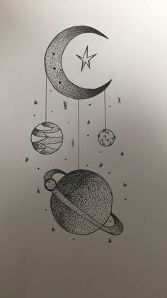 a drawing of planets and stars hanging from the ceiling