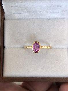 Natural Pink sapphire gemstone ring in 14k yellow gold Stone size - 6mmx4mm Stone weight- 0.60carats Formal Gold Sapphire Ring With Pink Sapphire, Classic Pink Sapphire Ring For Formal Occasions, Formal Pink Sapphire Ring In Yellow Gold, Formal Yellow Gold Pink Sapphire Ring, Gold Oval Pink Sapphire Rings, Oval Yellow Gold Sapphire Ring With Gemstone, Oval Yellow Gold Sapphire Ring, Gold Pink Sapphire Round Ring, Classic Yellow Gold Rings With Pink Sapphire