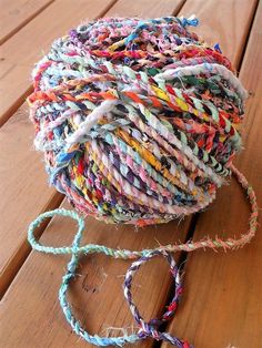 a ball of yarn sitting on top of a wooden table