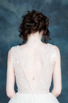 the back of a woman's wedding dress