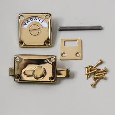 an assortment of hardware and screws on a white surface