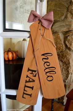 two wooden signs with the words welcome fall on them