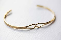 Diamond Bend Cuff Bracelet. $12.00, via Etsy. Retro Gold Cuff Bracelet As A Gift, Retro Gold Bangle As Gift, Retro Gold Bangle As A Gift, Retro Gold Bangle For Gift, Handmade Retro Bangle For Gifts, Retro Gold Bangle Cuff Bracelet, Vintage Cuff Bangle Bracelet As Gift, Vintage Bangle Cuff Bracelet As A Gift, Adjustable Retro Gold Bangle