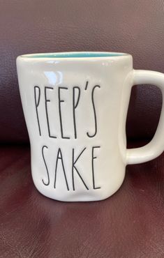 a white coffee mug with the words peep's sake written on it