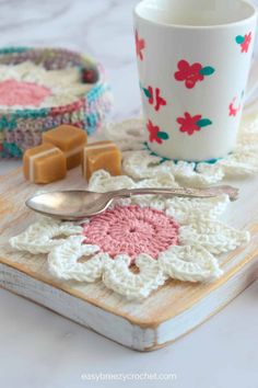 crocheted coasters with coffee mug and spoon on them