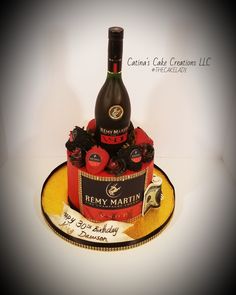 a cake with a bottle of wine on top