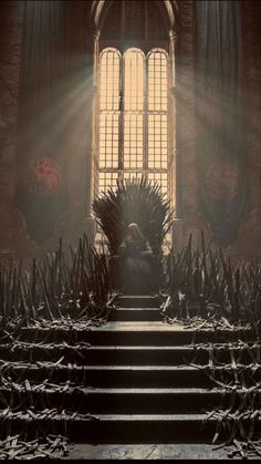 the iron throne sits in front of an open window with sunlight streaming through it and stairs leading up to it