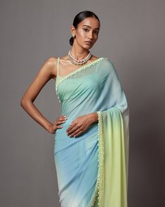 Ombre saree with foam sequence on the border paired with a beaded blouse. Blue Embellished Semi-stitched Pre-draped Saree, Embellished Blue Pre-draped Saree For Diwali, Festive Blue Embellished Pre-draped Saree, Semi-stitched Embellished Blue Blouse Piece, Blue Embellished Saree With Traditional Drape, Blue Bollywood Embellished Pre-draped Saree, Bollywood Blue Pre-draped Saree With Mirror Work, Semi-stitched Embellished Blue Saree, Embellished Blue Saree For Diwali