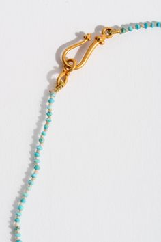 Our idea of the perfect stand necklace. Semi-precious turquoise heishi beads strung long with 22K findings. Part of our core collection of fine jewelry for daily wear and what we consider to be wardrobe staples. 22K Yellow Gold Findings + Turquoise Handmade in San Francisco Artisan Turquoise Jewelry With Tiny Beads, Artisan Turquoise Necklace With Gold Gemstone Beads, Artisan Turquoise Necklace With Polished Gold Beads, Artisan Gold Turquoise Necklace With Polished Beads, Artisan Gold Turquoise Necklace With Gemstone Beads, Bohemian Single Strand Turquoise Necklace In Gold, Artisan Beaded Turquoise Necklace In Gold, Artisan Gold Beaded Turquoise Necklace, Heishi Beads