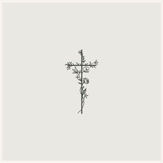 a black and white drawing of a cross with flowers