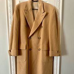 Brooks Brothers Men's Peak Lapel Coat. 100% Camel Hair, Luxurious Pea Coat. Gorgeous Natural Color. Heavy Weighted, Long, And Fully Lined. Original Buttons Intact, As Well As "Extra" Button Available Inside The Coat. Vintage And Timeless, This Beautiful Coat Is Perfect For The City! There Are A Few Small Spots Of Camel Hair Loss, As Pictured On The Inner Part Of The Sleeve- Authenticating That This Coat Has Sat In Someone's Closet For Over 25 Years. It's In Excellent Condition For A Vintage Piec Designer Beige Outerwear For Business, Classic Beige Outerwear, Classic Cream Outerwear For Semi-formal Occasions, Classic Beige Semi-formal Outerwear, Classic Semi-formal Cream Outerwear, Lapel Coat, Brooks Brothers Men, Coat Vintage, Peak Lapel