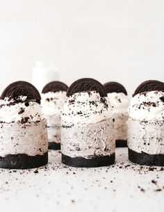 several oreo cookies and cream cheesecakes are arranged on top of each other